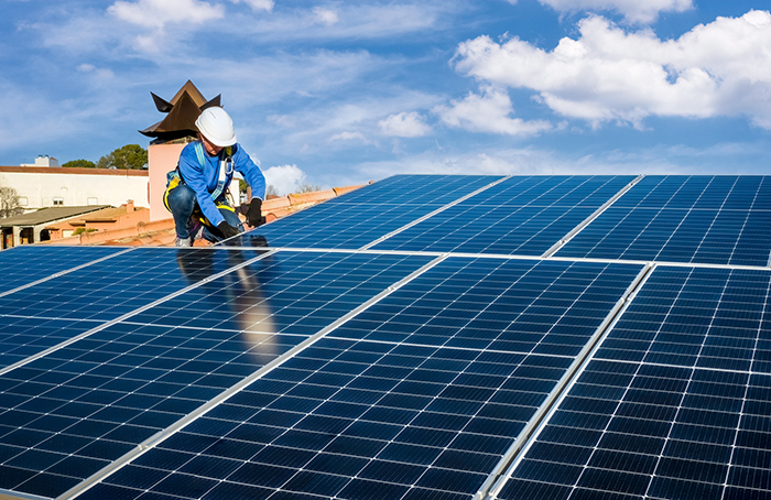 person installing solar panels