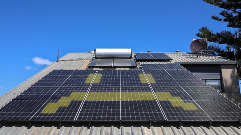 Solar panels on an Australian roof with glowing yellow frown.