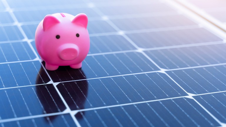 Piggybank on a solar panel.