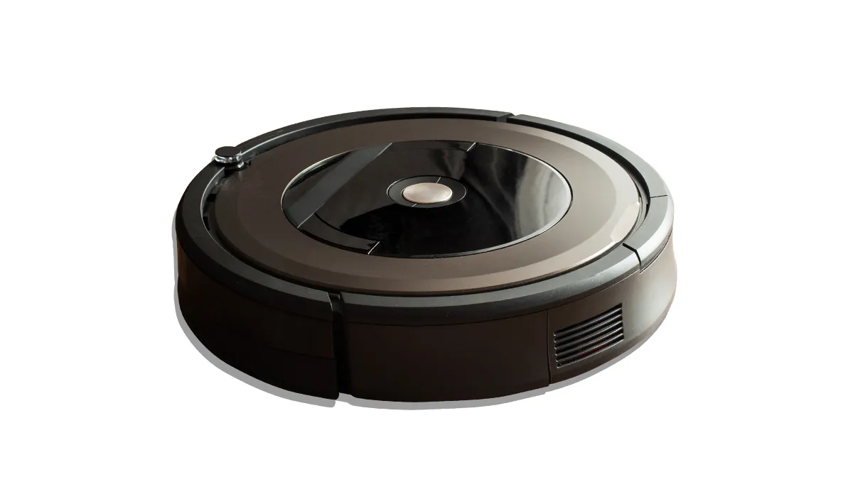 black robot vacuum on white background