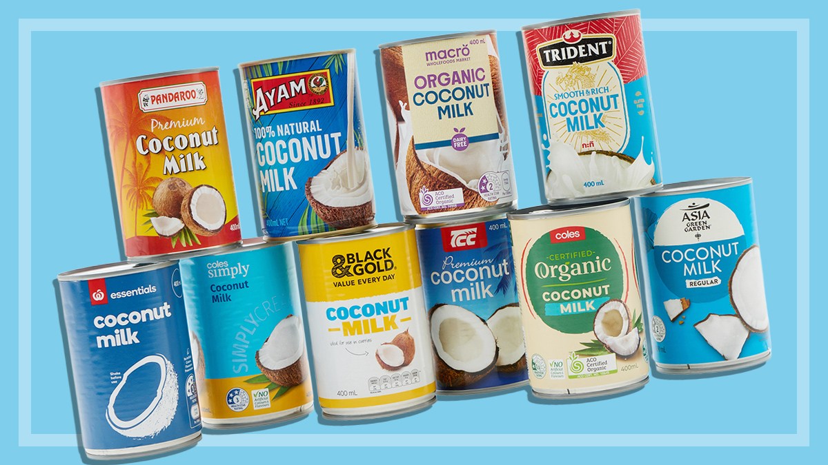 Ten different brands of tinned coconut milk on a blue background