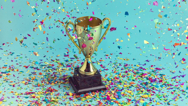 Trophy with coloured paper strips falling from above.