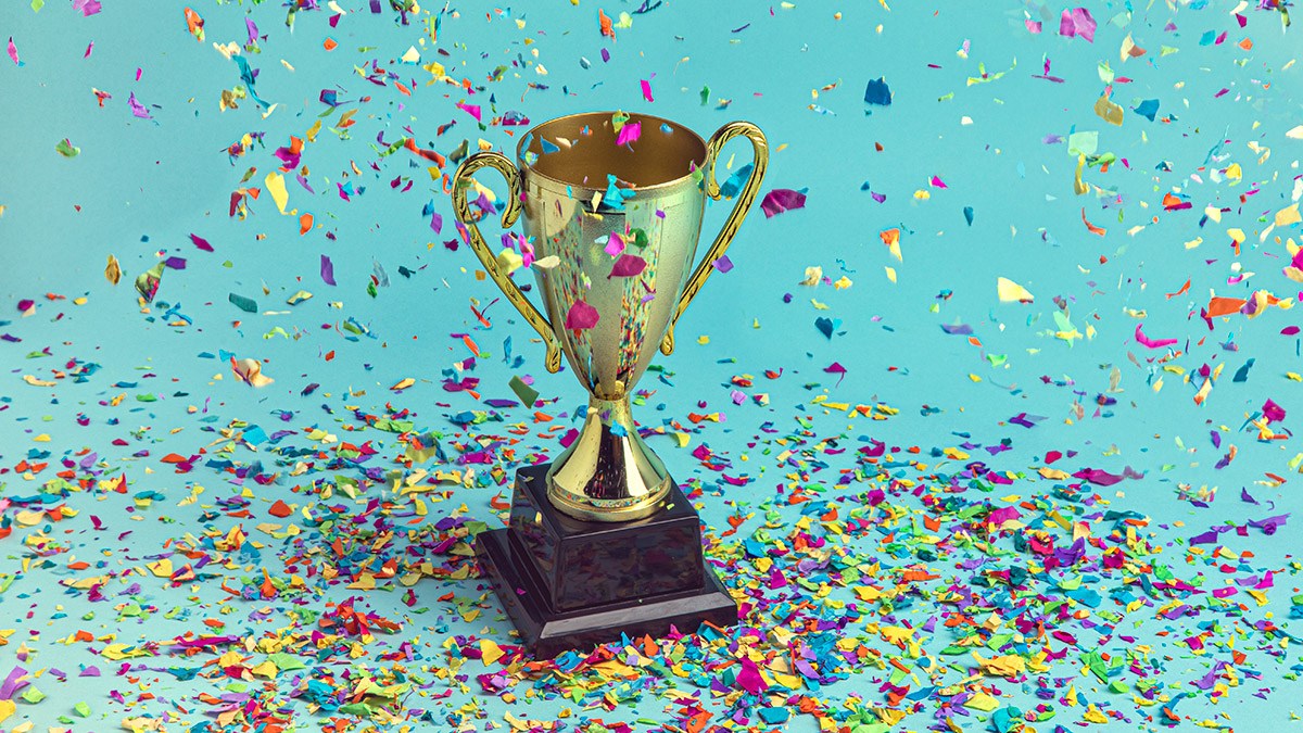 Trophy with coloured paper strips falling from above.